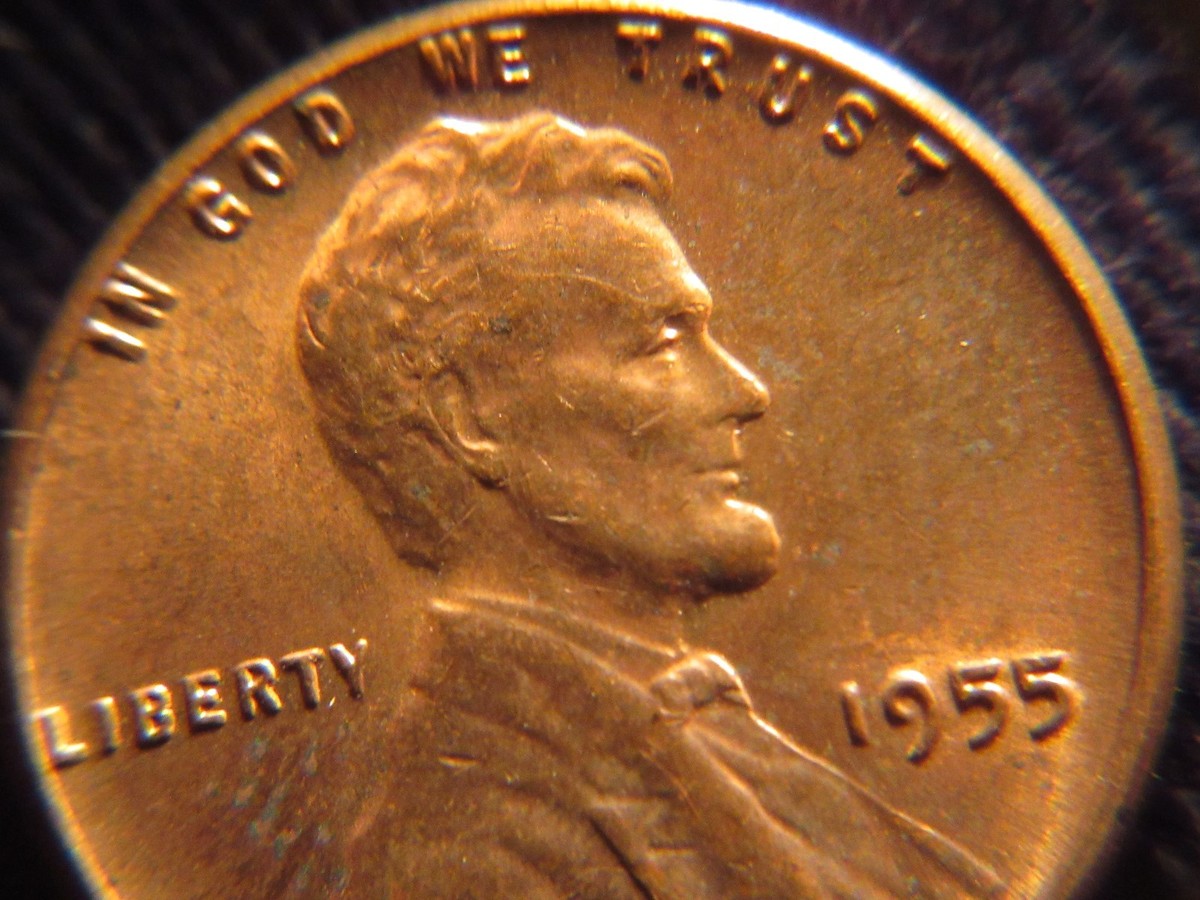 1955 wheat penny BIE die crack error showing raised vertical line between the B and E in LIBERTY resembling an extra letter I
